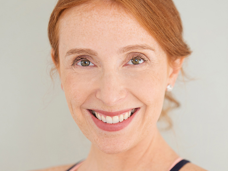 A headshot of Doctor Kathryn Levy smiling and looking at the viewer